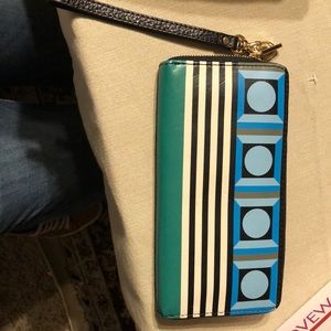 Green and blue textiles wallet with details